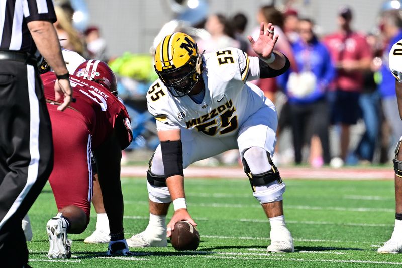 Oct 12, 2024; Amherst, Massachusetts, USA; Missouri Tigers offensive lineman Connor Tollison (55) snaps the ball during the first half against the Massachusetts Minutemen at Warren McGuirk Alumni Stadium. Mandatory Credit: Eric Canha-Imagn Images
