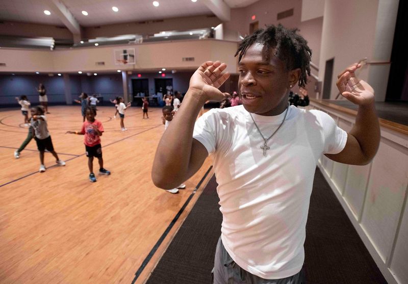 Student worker James Simpson leads a group of summer campers in a series of exercises at the Brownsville Community Center in July 2025. Simpson is working at the community center as part of Escambia County's Neighborhood and Human Services' Summer Youth Employment Program. It is his second year working within the program.