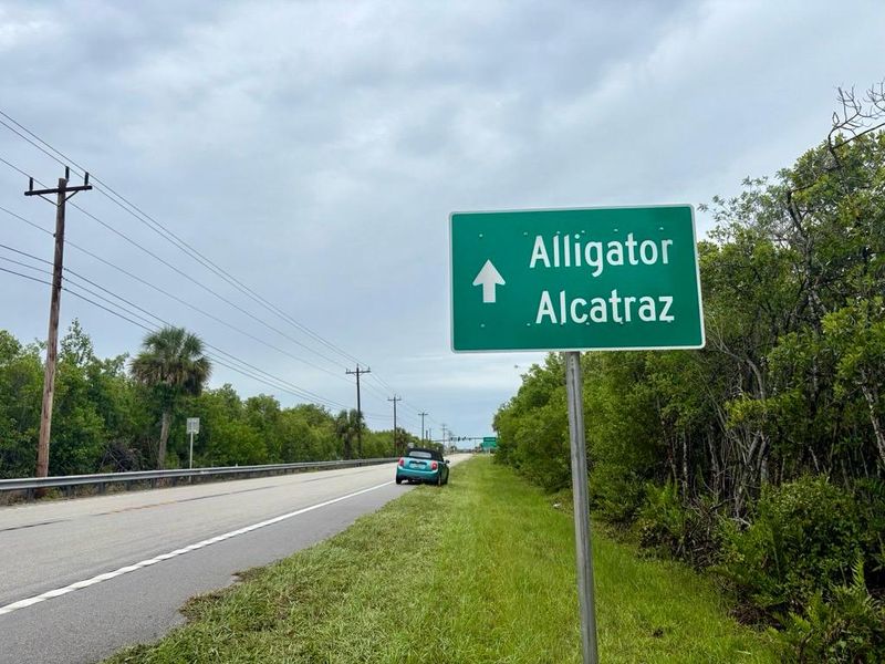 A new sign was installed for Alligator Alcatraz, the ICE detention center in the Florida Everglades. Opening day at the Dade-Collier Training Airport site in Ochopee, Florida, was July 1, 2025.