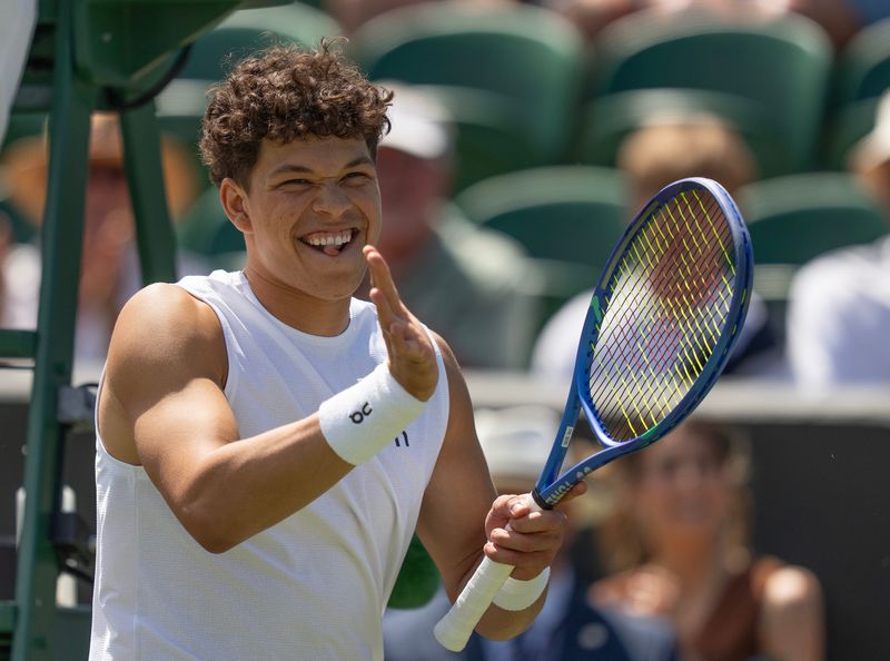 Jul 4, 2025; Wimbledon, United Kingdom; Ben Shelton of the United States celebrates winning his match against Rinky Hijikata of Australia on day five at the All England Lawn Tennis and Croquet Club. Mandatory Credit: Susan Mullane-Imagn Images
