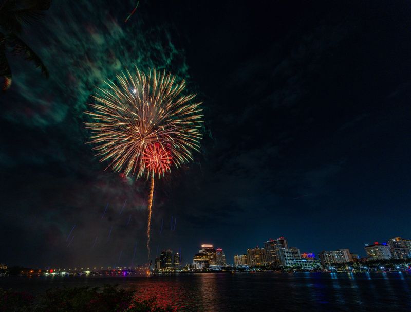 The annual 4th on Flagler fireworks show in West Palm Beach is seen from the Henry Morrison Flagler Museum in Palm Beach on July 4, 2025. Palm Beach will continue to sponsor the city's annual Independence Day celebration.