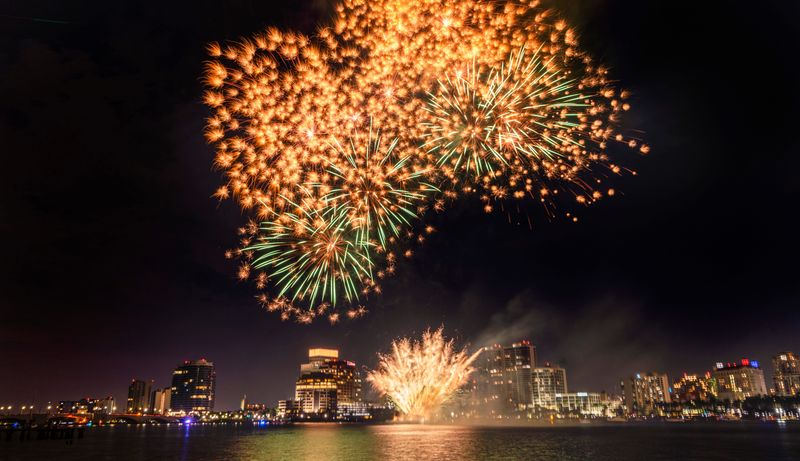 People line Lake Trail in Palm Beach to see the fireworks during the 37th annual 4th on Flagler event on July 4, 2025 in West Palm Beach, Florida.