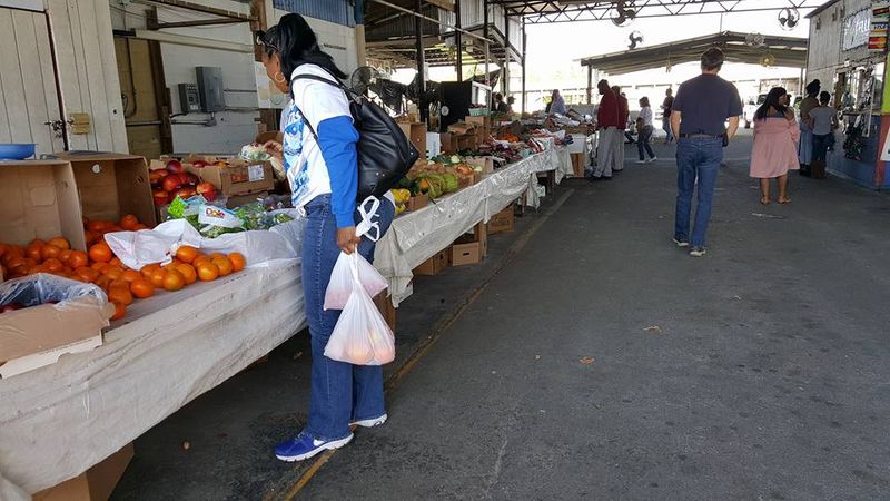 Shoppers peruse the aisles at the Tallahassee flea market in this undated photo.