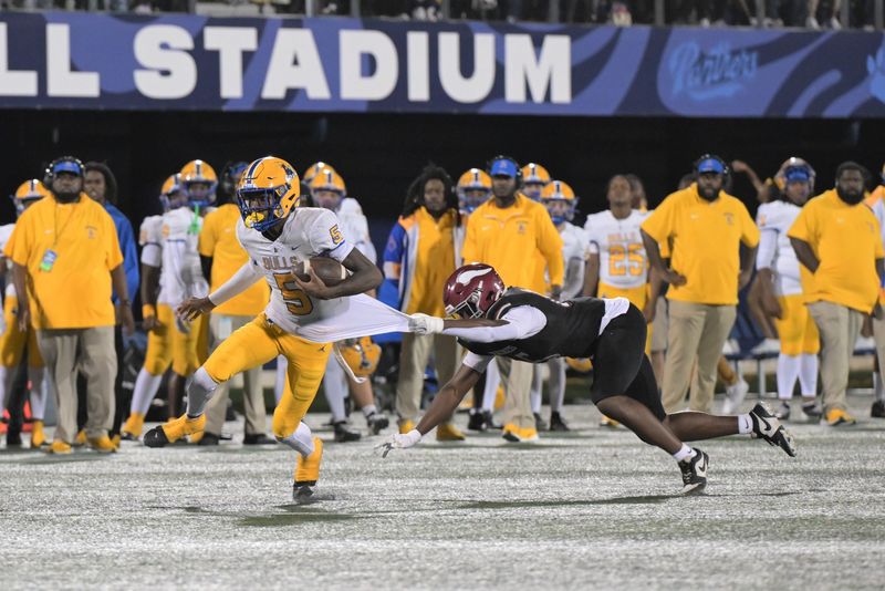 Miami Northwestern's Calvin Russell Jr. breaks a tackle during the Class 3A state championship on Dec. 14, 2024.