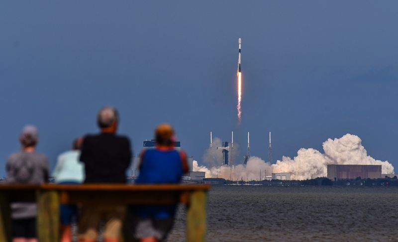 Spectators at KARS Park on Merritt Island watch the launch of a SpaceX Falcon 9 rocket Feb. 11 carrying 21 Starlink satellites from Cape Canaveral Space Force Base.