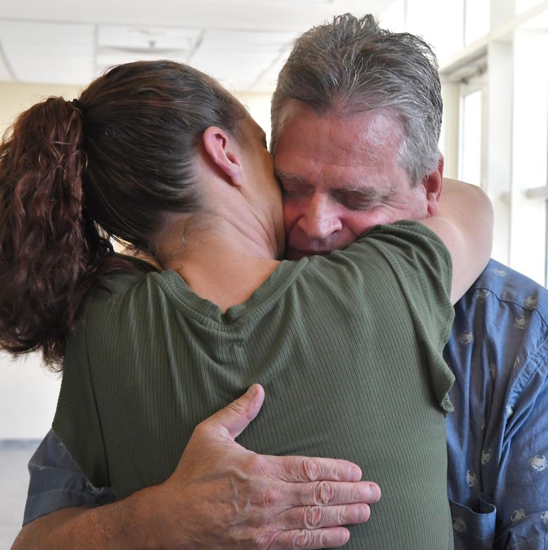 Jamie LeBlanc, daughter of Jeff Abramowski, hugs her dad after the state dropped all charges against him on July 7 in Judge Kelly McKibben’s courtroom in Viera.