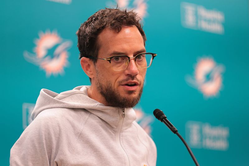 Jun 10, 2025; Miami, FL, USA; Miami Dolphins head coach Mike McDaniel talks to reporters before practice during mandatory minicamp at Hard Rock Stadium. Mandatory Credit: Sam Navarro-Imagn Images