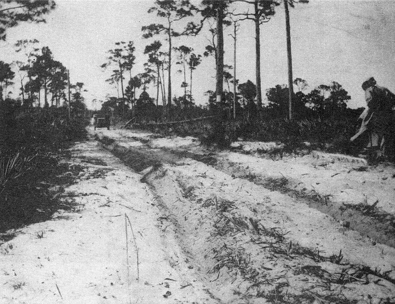 Dixie Highway in Palm Beach County, circa 1910, when getting to and from the area by means other than railroad or boat wasn't easy; the road was nothing but a brambly and bumpy dirt and sand path.