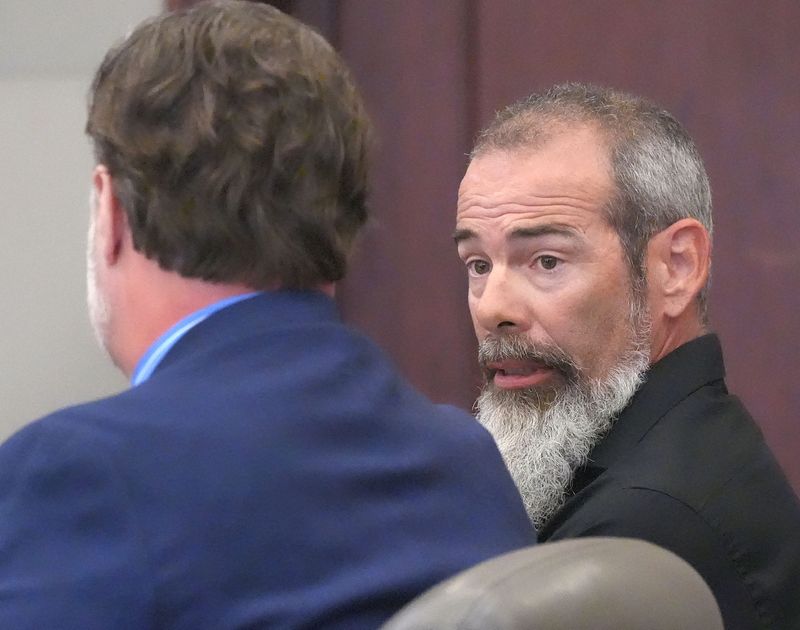 Gregg Pacheco talks with his defense attorney, Josh Davis, Tuesday, July 8, 2025, during sentencing for a 2024 road rage case in Circuit Judge Dawn Nichols courtroom at the Kim C. Hammond Justice Center in Bunnell.