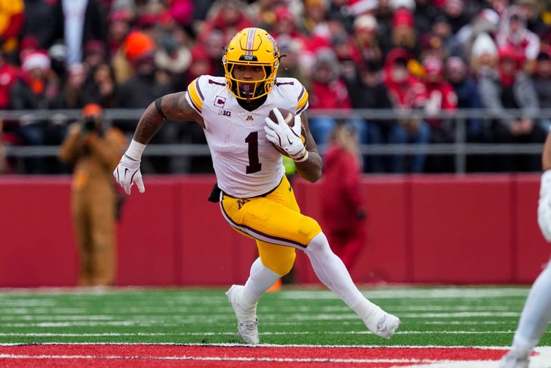 Nov 29, 2024; Madison, Wisconsin, USA; Minnesota Golden Gophers running back Darius Taylor (1) during the game against the Wisconsin Badgers at Camp Randall Stadium. Mandatory Credit: Jeff Hanisch-Imagn Images