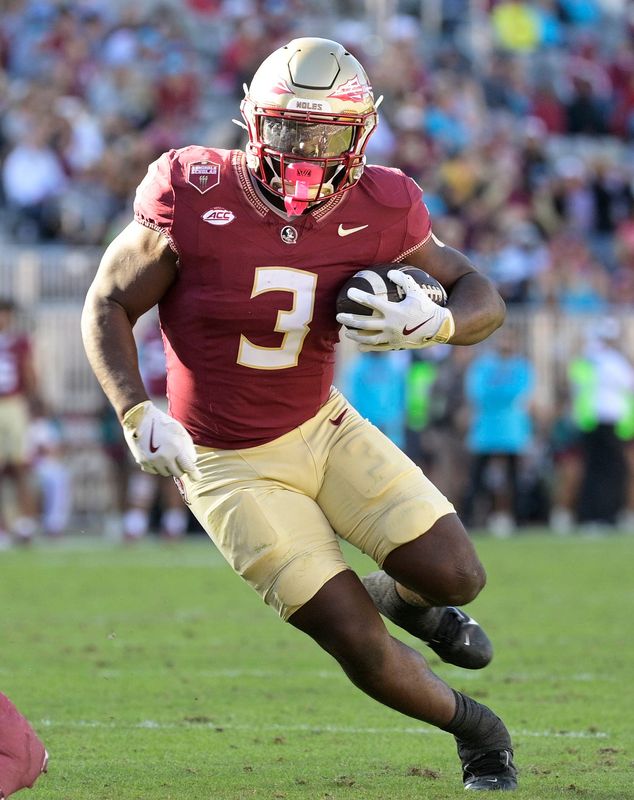 Nov 23, 2024; Tallahassee, Florida, USA; Florida State Seminoles running back Kam Davis (3) runs the ball during the second half of the game against the Charleston Southern Buccaneers at Doak S. Campbell Stadium. Mandatory Credit: Melina Myers-Imagn Images