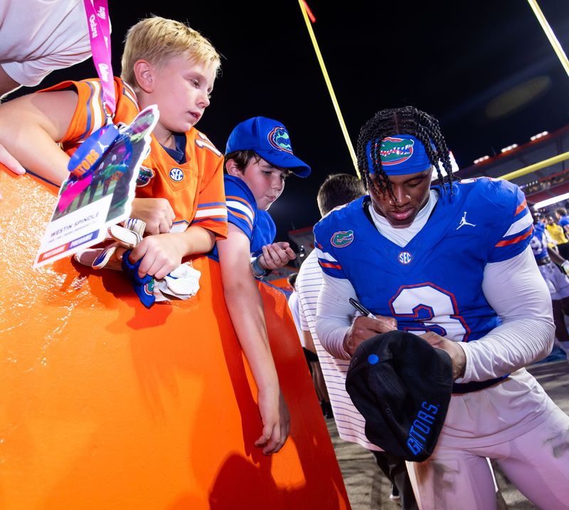 Florida Gators defensive back Jason Marshall Jr. (3) signs autographs for fans after the game at Ben Hill Griffin Stadium in Gainesville, FL on Saturday, October 5, 2024. The Gators defeated the Knights 24-13. [Doug Engle/Gainesville Sun]