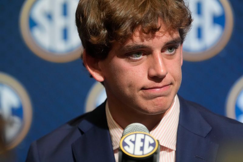 July 15, 2025; Atlanta, GA, USA; Texas quarterback Arch Manning listens to a question during SEC Media Days at the College Football Hall of Fame in Atlanta.