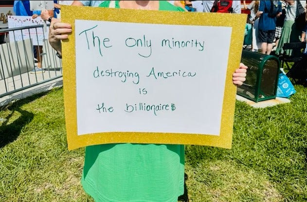 Protesters during national "No Kings" demonstrations on the green of St. Augustine's Castillo de San Marcos National Monument in June.