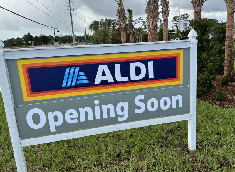 A "coming soon" sign can be seen in front of the new Aldi grocery store that's set to open at the end of the month at 5500 S. Williamson Blvd. in Port Orange, pictured on Wednesday, July 16, 2025.
