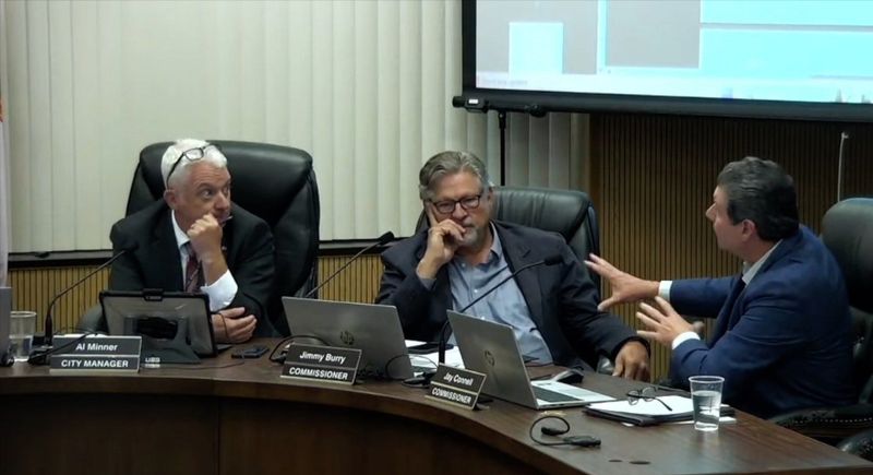 Commissioner Jay Connell defends his record of transparency while pushing a development moratorium to City Manager Al Minner as Commissioner Jimmy Burry looks on at the July 14, 2025, Leesburg City Commission meeting.