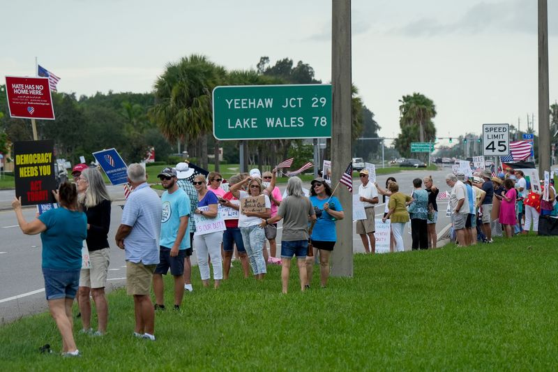 About 300 people gathered at the intersection of 58th Avenue and State Road 60 for the “Good Trouble Lives On” protest, which was organized across the country in response to what organizers say are attacks on civil and human rights by the Trump administration, July 17, 2025, in Vero Beach, Fla. The events were held on the 5th anniversary of the death of U.S. Rep. John Lewis of Georgia, a civil rights leader and politician, and named for a phrase he coined, “Good Trouble," meaning coming together to take peaceful, non-violent action to challenge injustice and create meaningful change, according to the movement's website.