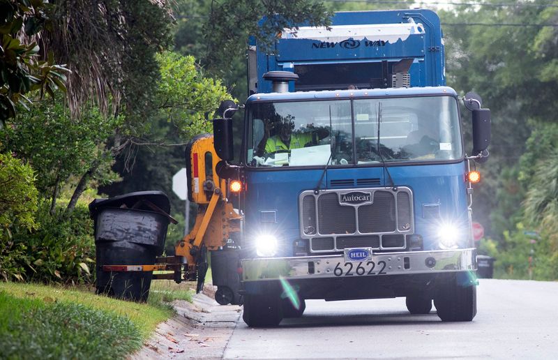 Garbage trucks run the weekly route in the East Hill Neighborhood on July 18, 2025. Pensacola is dealing with the fallout after many residents reported not receiving the city’s communications about the change to one-day-a-week garbage pickup as part of the new curbside recycling program. The issues come after weeks of complaints about the city’s sanitation department being behind with yard waste pickup.