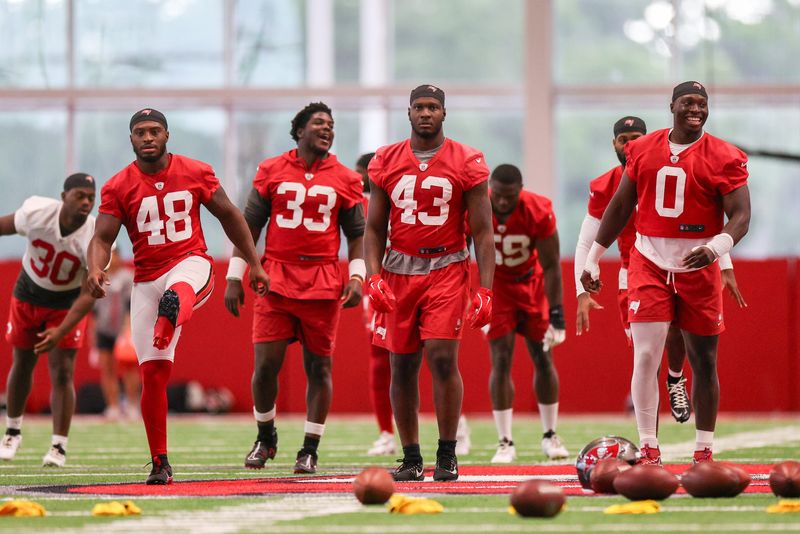Jun 10, 2025; Tampa Bay, FL, USA; Tampa Bay Buccaneers linebacker Antonio Grier Jr. (48) linebacker Jose Ramirez (33) linebacker Chris Braswell (43) and linebacker Yaya Diaby (0) participate in mini camp at AdventHealth Training Center. Mandatory Credit: Nathan Ray Seebeck-Imagn Images