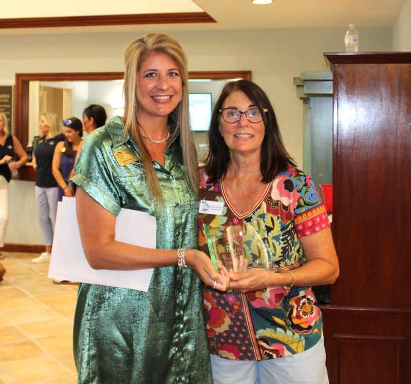 Lori Joyner, right, executive director of Harvest House, was named Business Person of the Quarter during the Destin Chamber’s July 15 Great American Cookout. The Business Person of the Quarter is presented directly from the Chamber's Board of Directors. Presenting the award is the chair of the brad, Jennie Brunson, left.