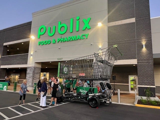 A giant Publix shopping cart is seen outside on July 19, 2025, at the grand opening of Publix Riverland Town Center at 12407 S.W. Community Blvd.