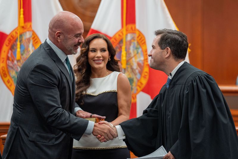 Blaise Ingoglia, left, is sworn-in by Florida Supreme Court Justice John Couriel as Florida Chief Financial Officer during a ceremony held at the Capitol on Monday, July 21, 2025.