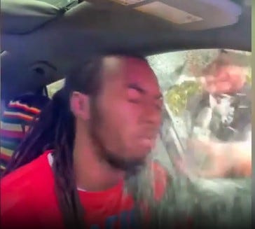 William McNeil Jr. is shown as his driver's side window is broken by police during a traffic stop in February 2025.