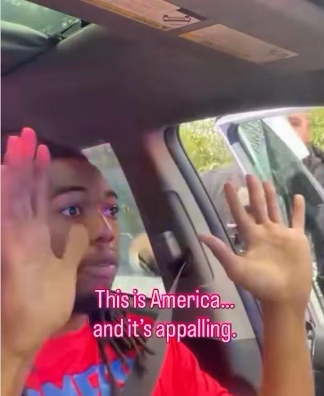 William McNeil puts his hands up during a traffic stop for not having his headlights on Feb. 19, 2025, in a video he posted on Instagram. It shows a Jacksonville officer smashed his window and punched him because he wouldn't come out.