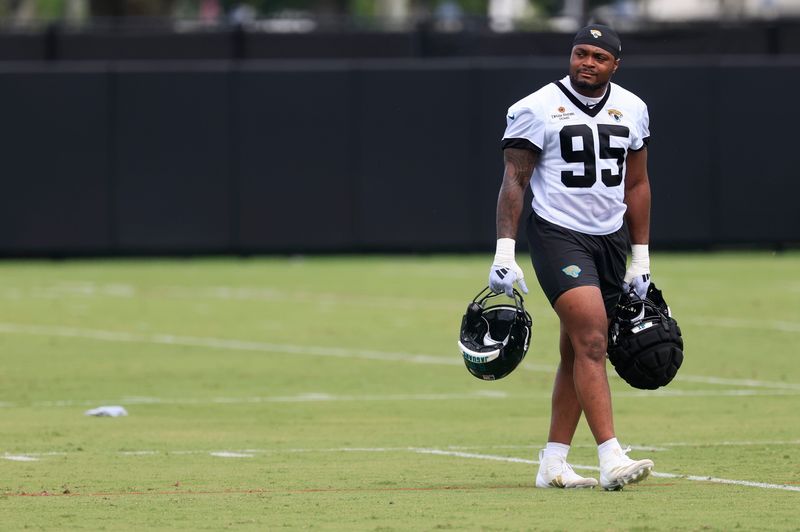 Jacksonville Jaguars defensive lineman B.J. Green II (95) walks to the locker room after an NFL training camp session at the Miller Electric Center, Wednesday, July 23, 2025, in Jacksonville, Fla. [Corey Perrine/Florida Times-Union]
