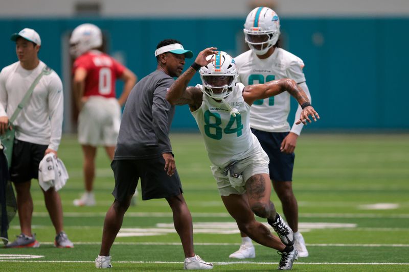 Jul 23, 2025; Miami Gardens, FL, USA; Miami Dolphins wide receiver Erik Ezukanma (84) works during training camp at Baptist Health Training Complex. Mandatory Credit: Sam Navarro-Imagn Images