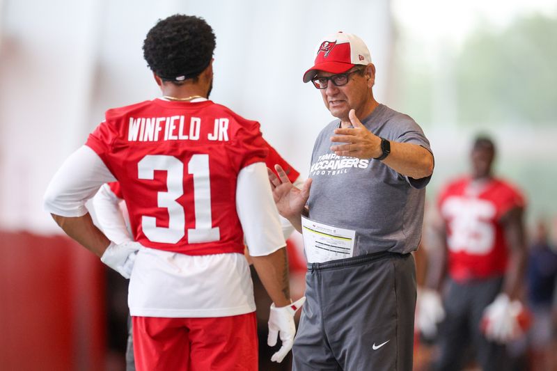 Jun 10, 2025; Tampa Bay, FL, USA; Tampa Bay Buccaneers safeties coach Nick Rapone talks to safety Antoine Winfield Jr. (31) during mini camp at AdventHealth Training Center. Mandatory Credit: Nathan Ray Seebeck-Imagn Images