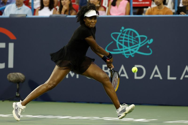 Jul 22, 2025; Washington, D.C., USA; Venus Williams (USA) hits a backhand against Peyton Stearns (USA)(not pictured) in a women's singles match on day two of the Mubadala Citi DC Open at Rock Creek Park Tennis Center. Mandatory Credit: Geoff Burke-Imagn Images