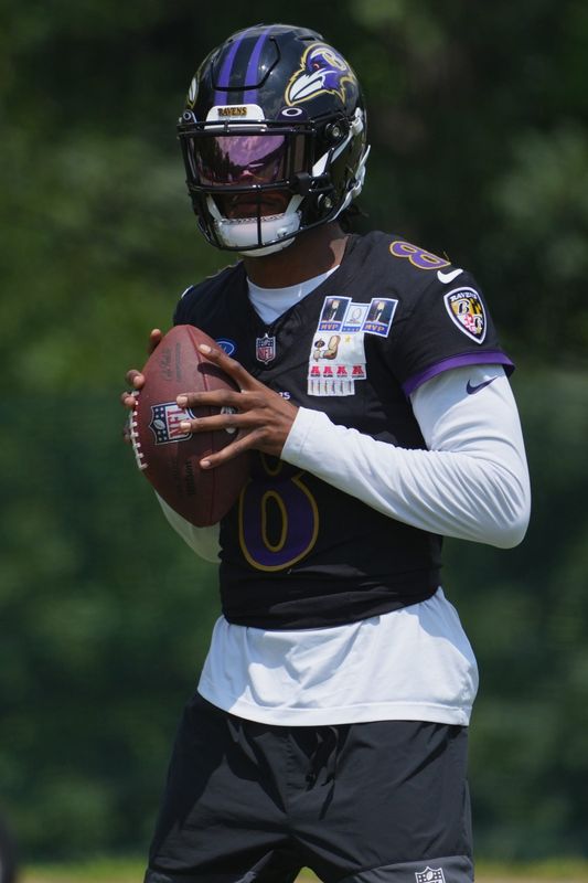 Jul 23, 2025; Owings Mills, MD, USA; Baltimore Ravens quarterback Lamar Jackson (8) warms up during training camp at Under Armour Performance Center. Mandatory Credit: Mitch Stringer-Imagn Images