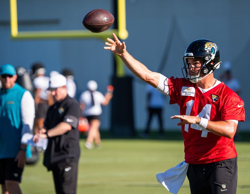 Jacksonville Jaguars head coach Liam Coen watches as Jacksonville Jaguars quarterback Nick Mullens (14) rolls out and passes during an NFL training camp second session at the Miller Electric Center, Thursday, July 24, 2025, in Jacksonville, Fla. [Doug Engle/Florida Times-Union]