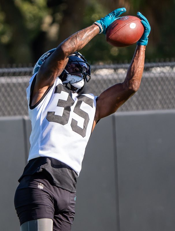 Jacksonville Jaguars cornerback Doneiko Slaughter (35) hauls in an interception during an NFL training camp second session at the Miller Electric Center, Thursday, July 24, 2025, in Jacksonville, Fla.