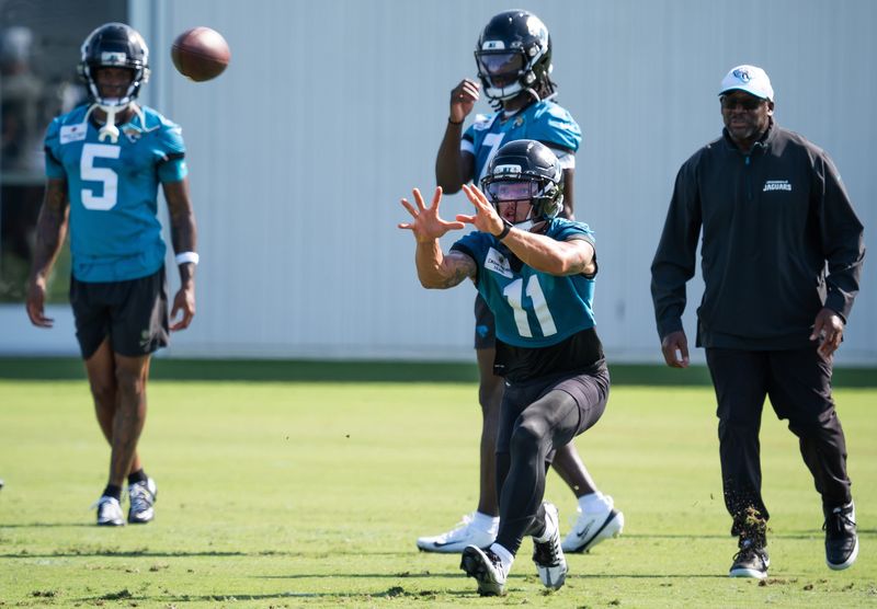 Jacksonville Jaguars wide receiver Parker Washington (11) hauls in a pass during the Jacksonville Jaguarsâ€™ third mandatory minicamp Thursday June 12, 2025 at the Miller Electric Center in Jacksonville, Fla. [Doug Engle/Florida Times-Union]