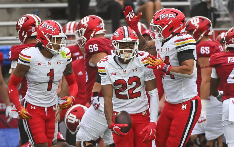 Sep 28, 2024; Bloomington, Indiana, USA; Maryland Terrapins defensive back Jalen Huskey (22) celebrates with teammates after an interception against the Indiana Hoosiersduring the first half at Memorial Stadium. Mandatory Credit: Robert Goddin-Imagn Images