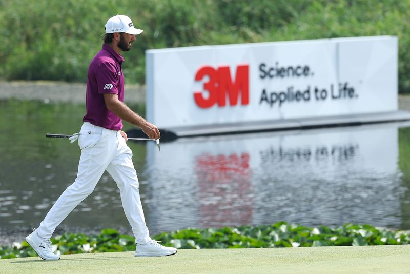 Max Homa walks on the sixth green during the second round of the 3M Open golf tournament.