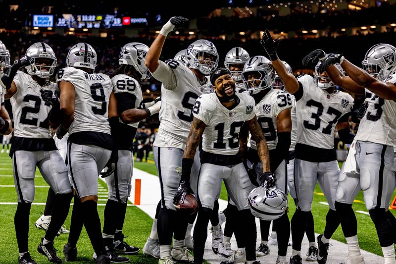Dec 29, 2024; New Orleans, Louisiana, USA; Las Vegas Raiders cornerback Jack Jones (18) reacts to intercepting a play from New Orleans Saints quarterback Spencer Rattler (18) during the second half at Caesars Superdome. Mandatory Credit: Stephen Lew-Imagn Images