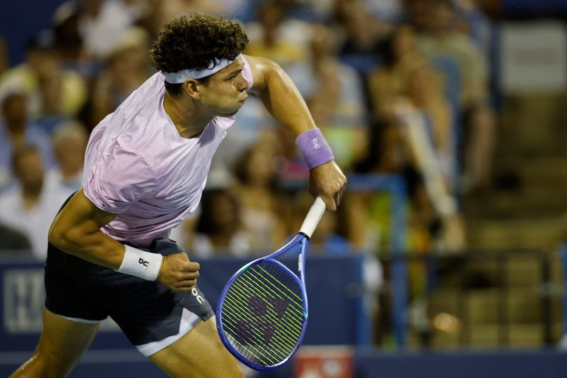 Jul 25, 2025; Washington, D.C., USA; Ben Shelton (USA) serves against Frances Tiafoe (USA)(not pictured) in a men's singles quarter-final of the Mubadala Citi DC Open at Rock Creek Park Tennis Center. Mandatory Credit: Geoff Burke-Imagn Images