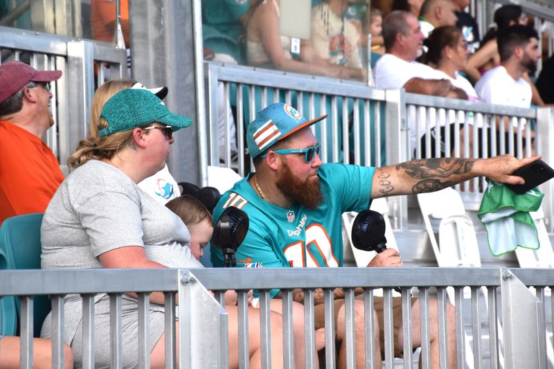 Miami Dolphins fans flock to the team's training field to watch Day 4 of training camp, cheering as players signed autographs and took photos on July 26, 2025.
