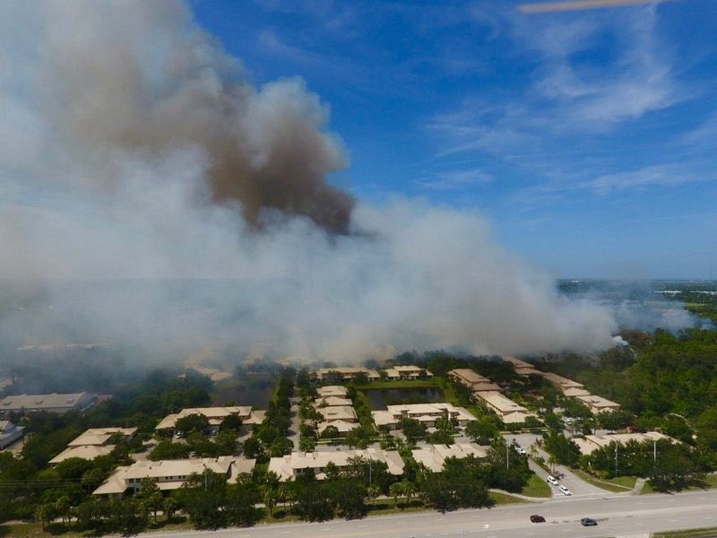 This drone image shows a wildfire that broke out at Oslo Road just west of 20th Avenue Southwest in Indian River County July 27, 2025. The near 25-acre fire in a wooded area was fully contained at 5 p.m.