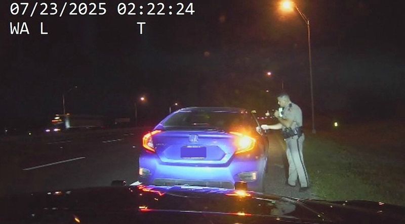 A Florida Highway Patrol trooper tickets a driver going 116 mph in a 60 mph zone on Interstate 4 near Lake Mary,. Florida, Wednesday, July 23, 2025. A new state law adds harsher penalties and even jail time to "super speeding."