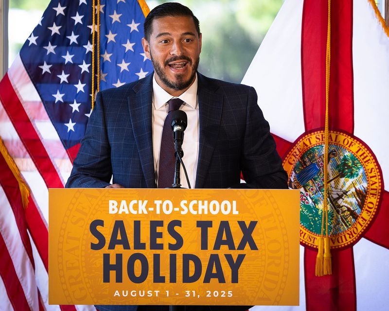 Anastasios Kamoutsas, commissioner of the Florida Department of Education, delivers remarks at Boon Docks Restaurant in Panama City Beach, Fla., July 28, 2025, about the state’s Back-To-School sales tax holiday. Tax-free items are valid through August. (Tyler Orsburn/News Herald)