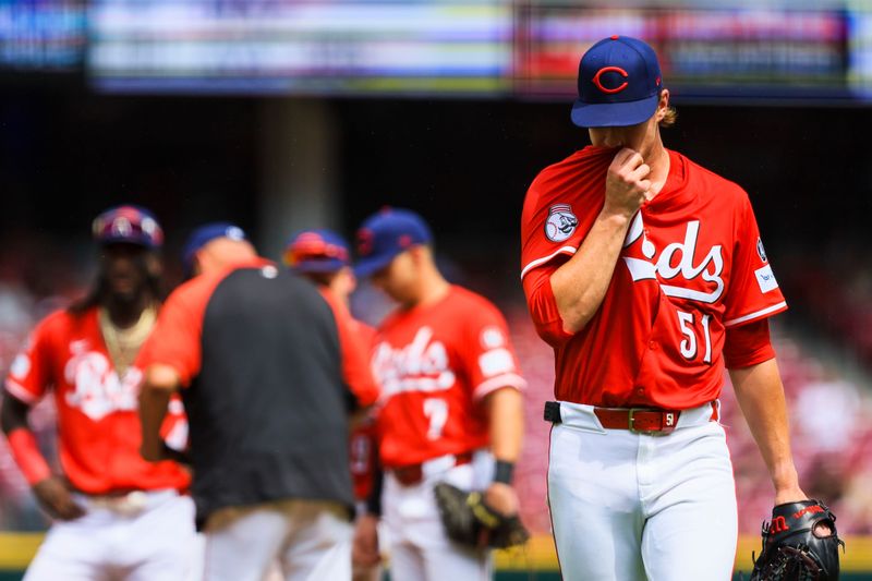 Jul 27, 2025; Cincinnati, Ohio, USA; Cincinnati Reds starting pitcher Brady Singer (51) walks off the field during a pitching change in the eighth inning against the Tampa Bay Rays at Great American Ball Park. Mandatory Credit: Katie Stratman-Imagn Images