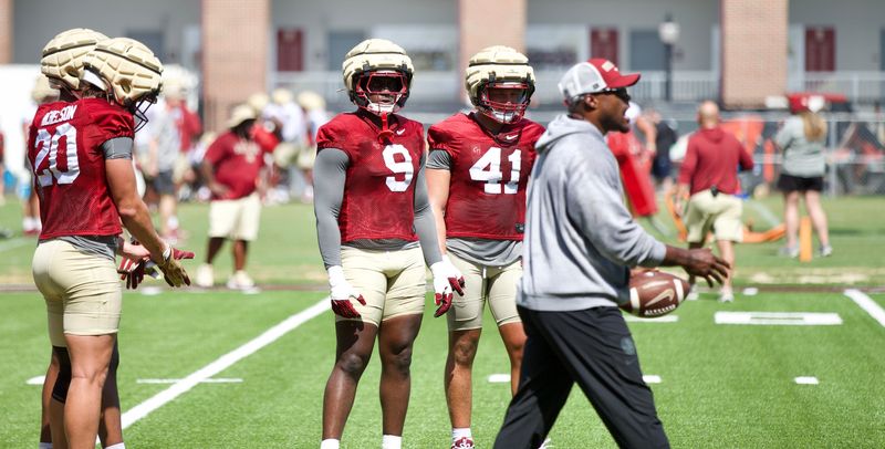 FSU football's Ernie Sims instructs players at the first practice of preseason camp on Wednesday, July 30, 2025