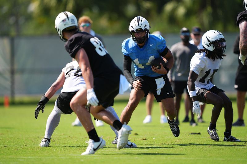 Cam Fancher (14) is one of three UCF quarterbacks competing for the starting job ahead of the Aug. 28 opener versus Jacksonville State.