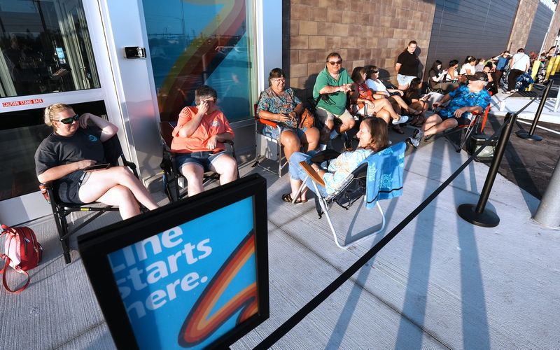 Amy Gibson, at left wearing sunglasses, arrived at 3:15 a.m. to be first in line for the grand opening of the new Aldi grocery store at 5500 S. Williamson Blvd. in Port Orange, Thursday morning July 31, 2025. By the time the discount grocery store opened its doors at 8:50 a.m., the line had grown to more than 250 people.