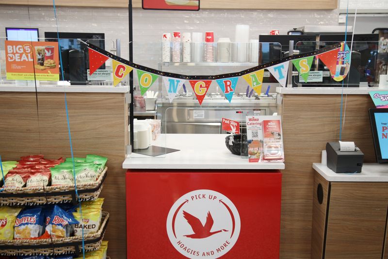 Patrons and employees celebrate the grand opening of the new Wawa in Milltown on August 1, 2025.
