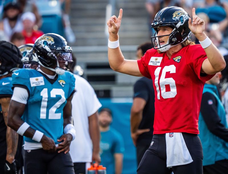 Jacksonville Jaguars quarterback Trevor Lawrence (16) calls a play with teammate wide receiver Travis Hunter (12) in the background before an NFL scrimmage at EverBank Stadium Friday August 1, 2025, in Jacksonville, Fla. [Doug Engle/Florida Times-Union]